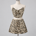 White Fox Sequin Two Piece Set Zebra on an ivory display mannequin; AI-generated styling visualization. Original product photos retained for reference.